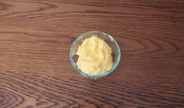 Homemade butter in a bowl on a table